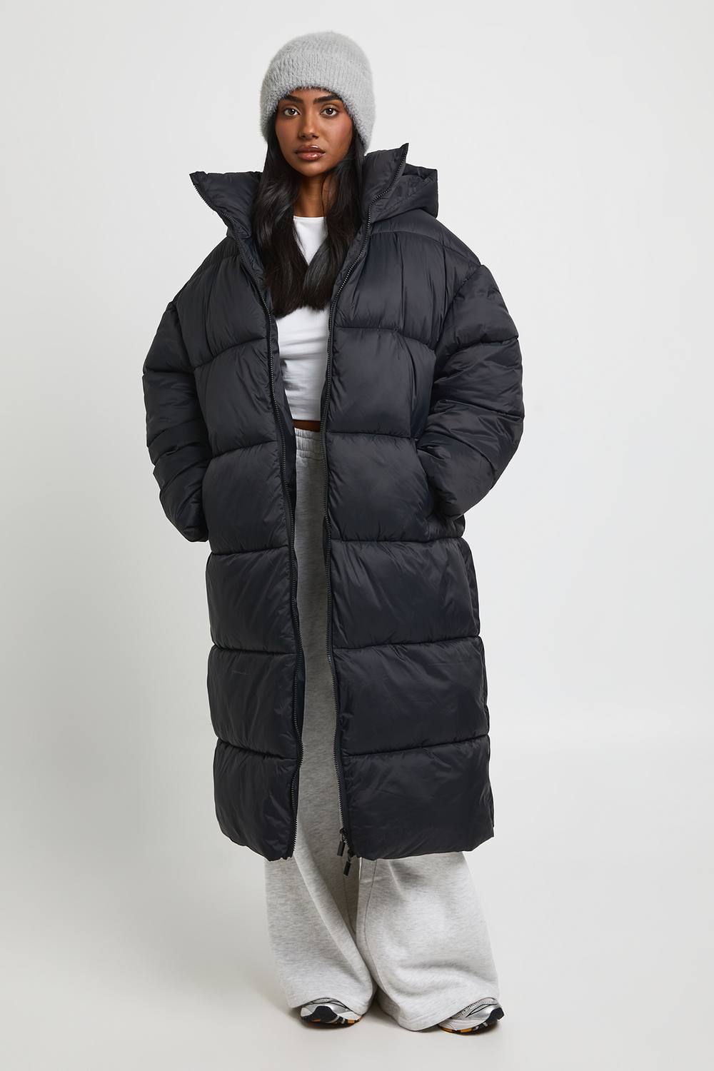 boohoo Women's Hooded Belted Longline Puffer Jacket in Black by boohoo