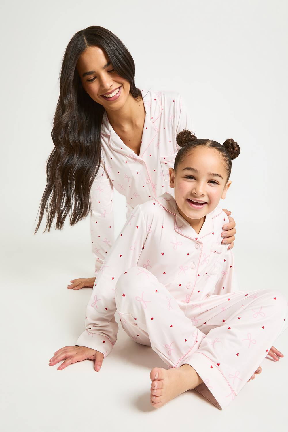 boohoo Girl's Kids Matching Family Super Soft Bow & Heart Print Long Sleeve Top & Trousers Pyjama Set in Light Pink by boohoo
