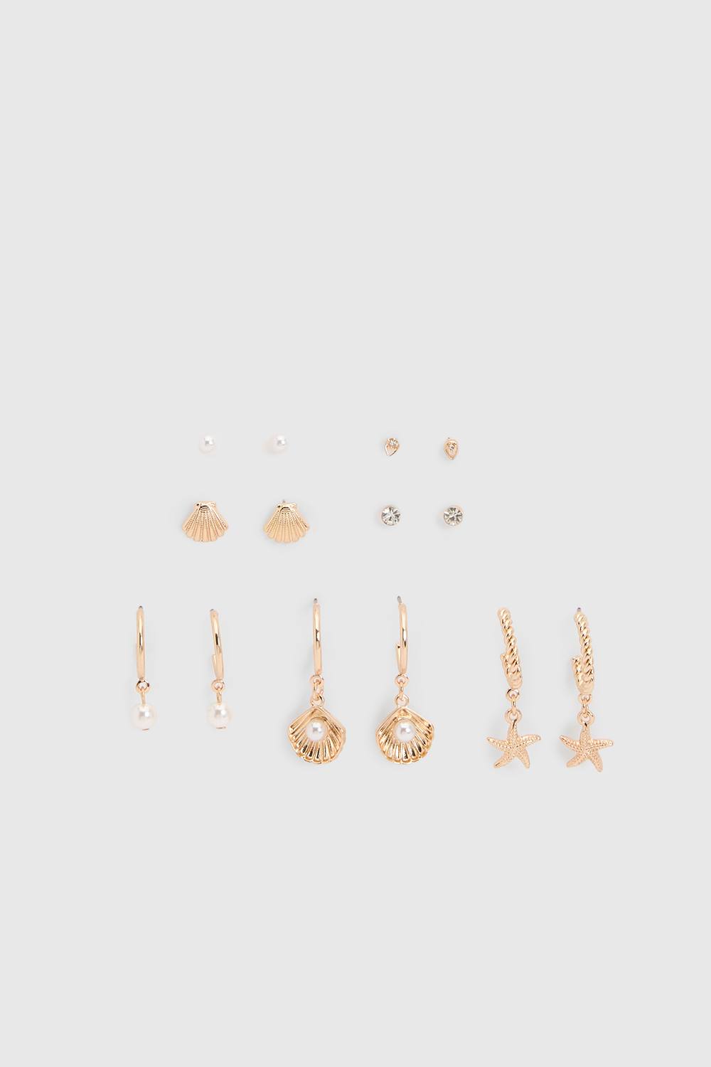 boohoo Women's Ocean Detail Stacking Earrings 7 Pack in Gold by boohoo