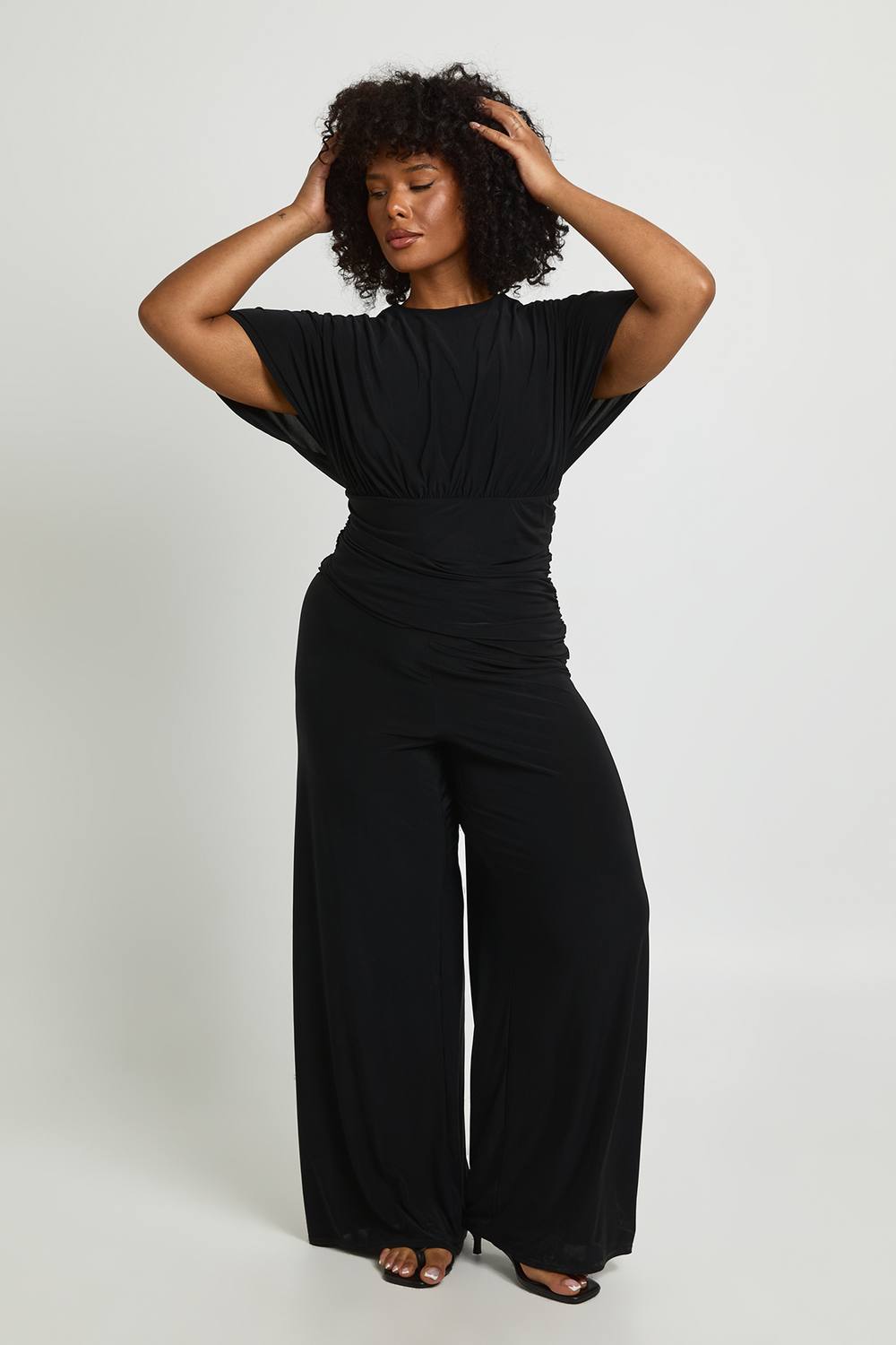 boohoo Women's Plus Angel Sleeve Ruched Asymmetric Waist Jumpsuit in Black by boohoo