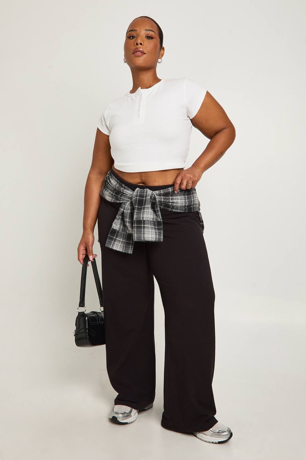boohoo Women's Plus Basic Fold Over Waistband Flared Legging Pants in Black by boohoo