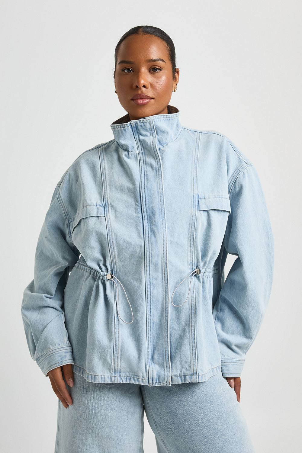 boohoo Women's Plus Oversized Funnel Neck Denim Cinched Waist Jacket in Bleach Wash by boohoo