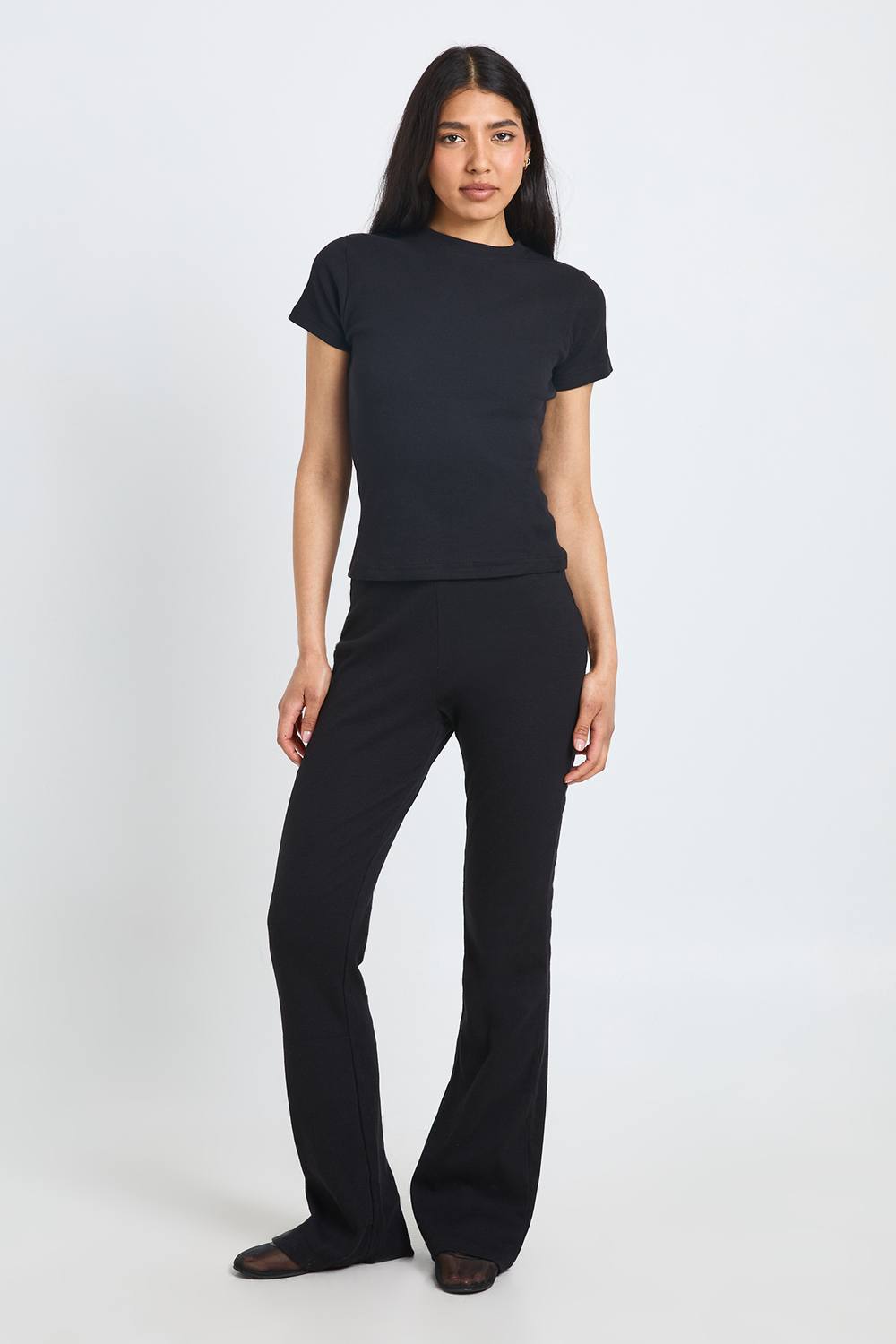 boohoo Women's Tall Basic Rib Flared Legging Trouser in Black by boohoo