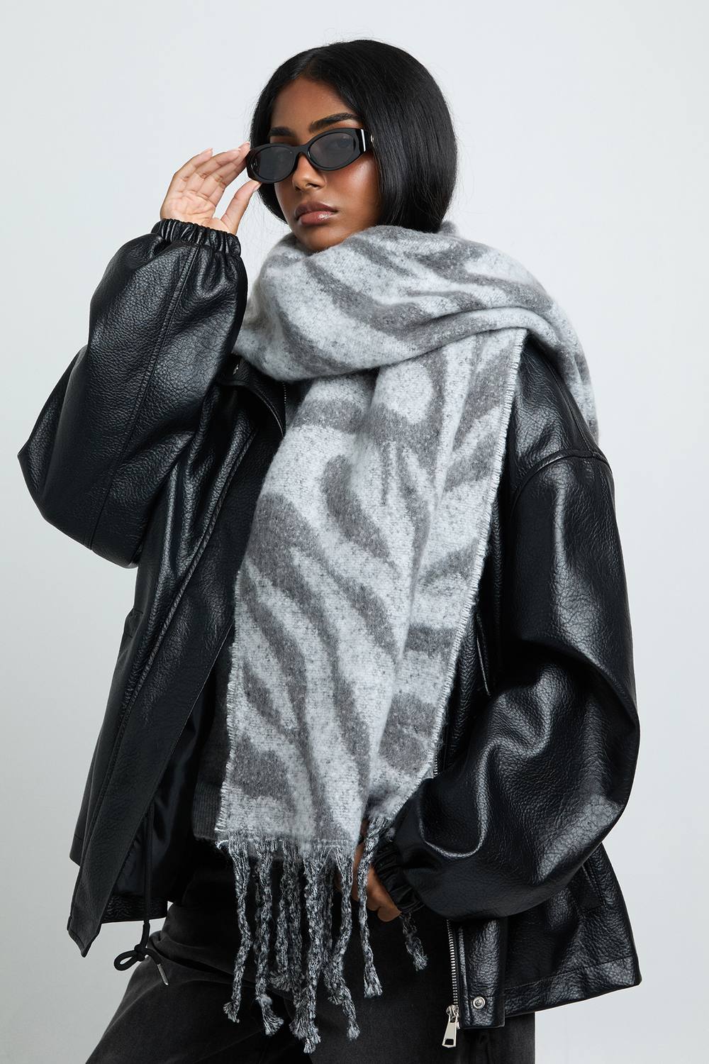boohoo Women's Zebra Print Tassel Fluffy Scarf in Grey by boohoo