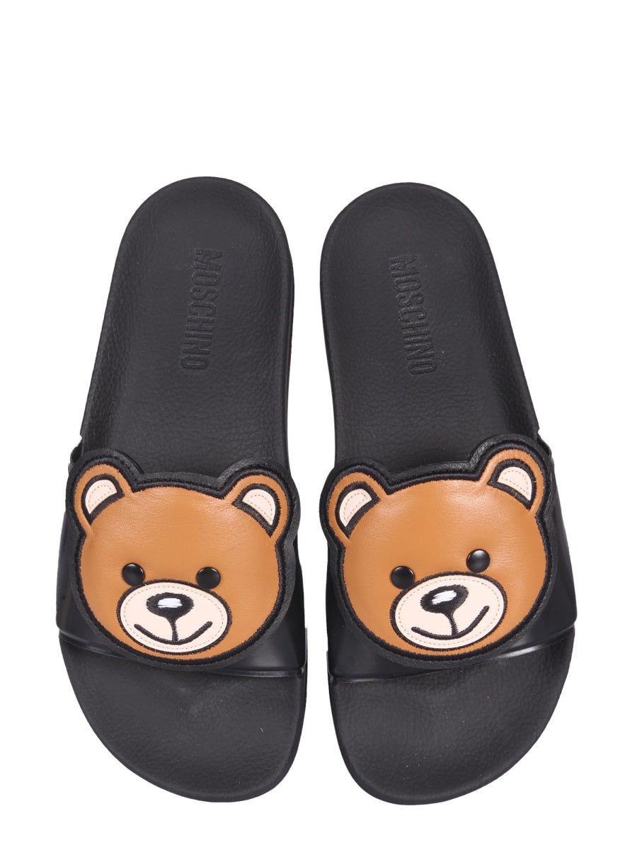 Moschino Teddy Bear Rubber Slide Sandals — Black by Moschino